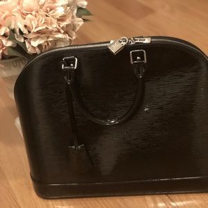 Louis  Vuitton !Alma large but glossy leather .